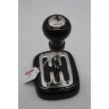 A reproduction paperweight, in the form of a Ferrari gear stick, height 17cm
