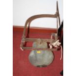 A vintage brass bell, on a wrought iron bracket, the bell height 23cm