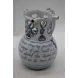 An 18th century Liverpool Delftware puzzle jug, h.18cmHas been restored to handle and rim.