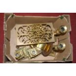 A collection of mixed brassware to include a 19th century pierced brass trivet and a pair of