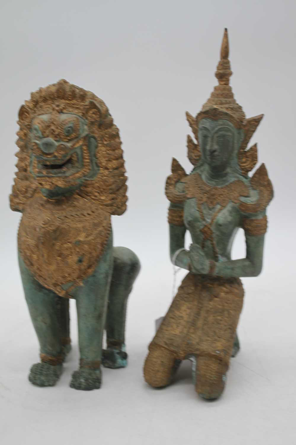 An eastern verdigris and gilt metal figure of a deity, shown kneeling, height 32cm; together with