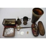 A collection of miscellaneous items to include various gaming tokens, small silver trophy cup, set
