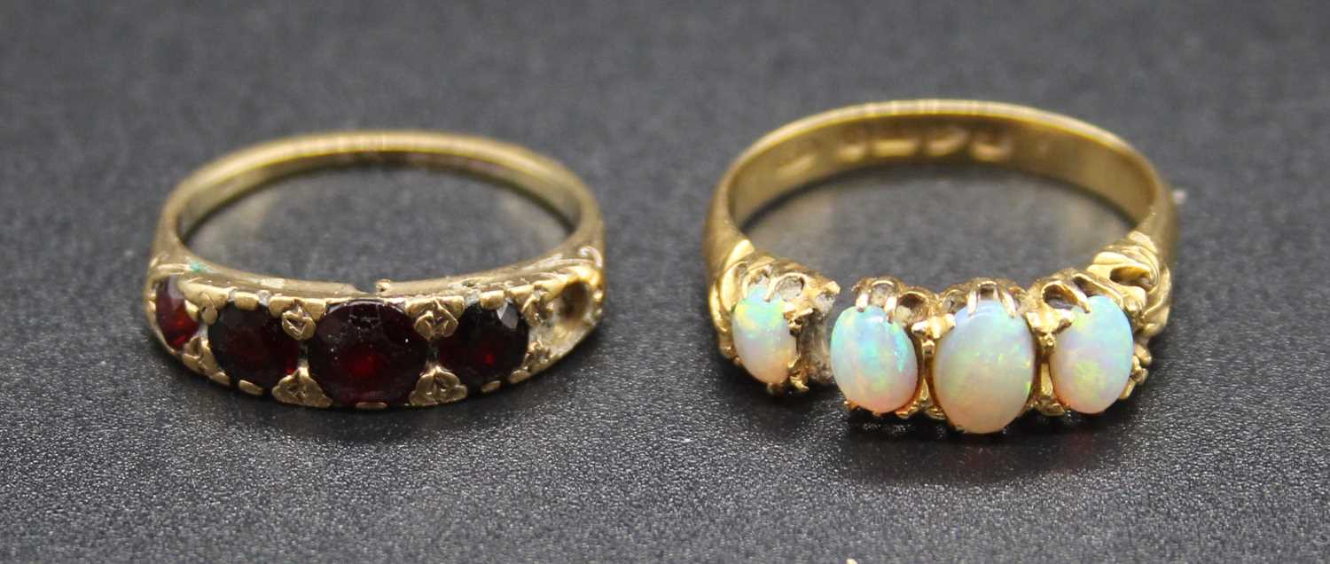 An 18ct gold cabochon opal four stone dress ring, 3.5g, size P (a/f); together with a 9ct gold