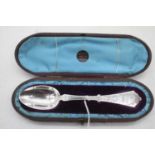 A Victorian silver christening spoon having a plain oval bowl with bright cut engraved stem in