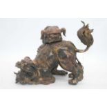 A Chinese gilt metal model of two dogs of Fo, height 24cm