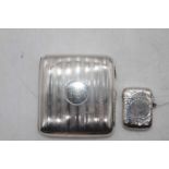 An Edwardian silver vesta of hinged rectangular form having a spot hammered finish, maker Joseph