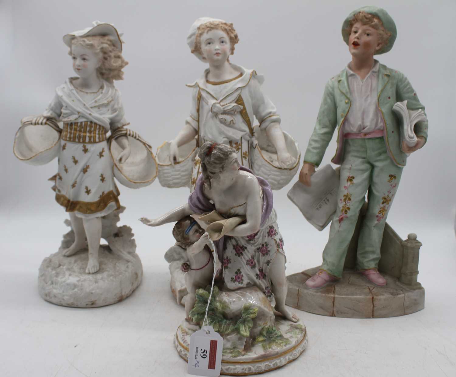 A German porcelain figure of a mother and child, height 23cm; together with three bisque porcelain - Image 2 of 2