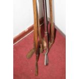 A collection of vintage golf clubs, the longest 115cm