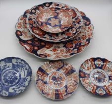 A Japanese Imari charger, of lobed form, dia. 45cm, together with another smaller, and four