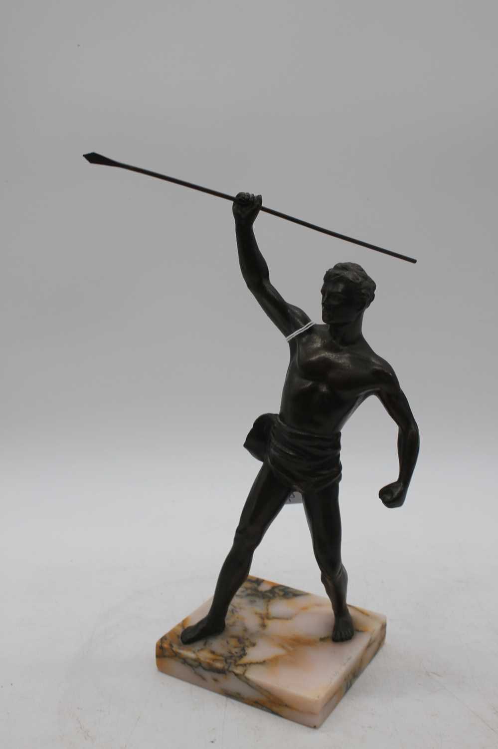 A pair of bronzed figures of athletes, each shown rasing a spear, mounted upon a polished - Image 3 of 3