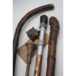 A vintage bamboo walking cane, 121cm; together with one other; a fishing rod; and a brass horn