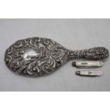 A Victorian fruit knife having a folding silver blade and engraved mother-of-pearl handles, 8cm (