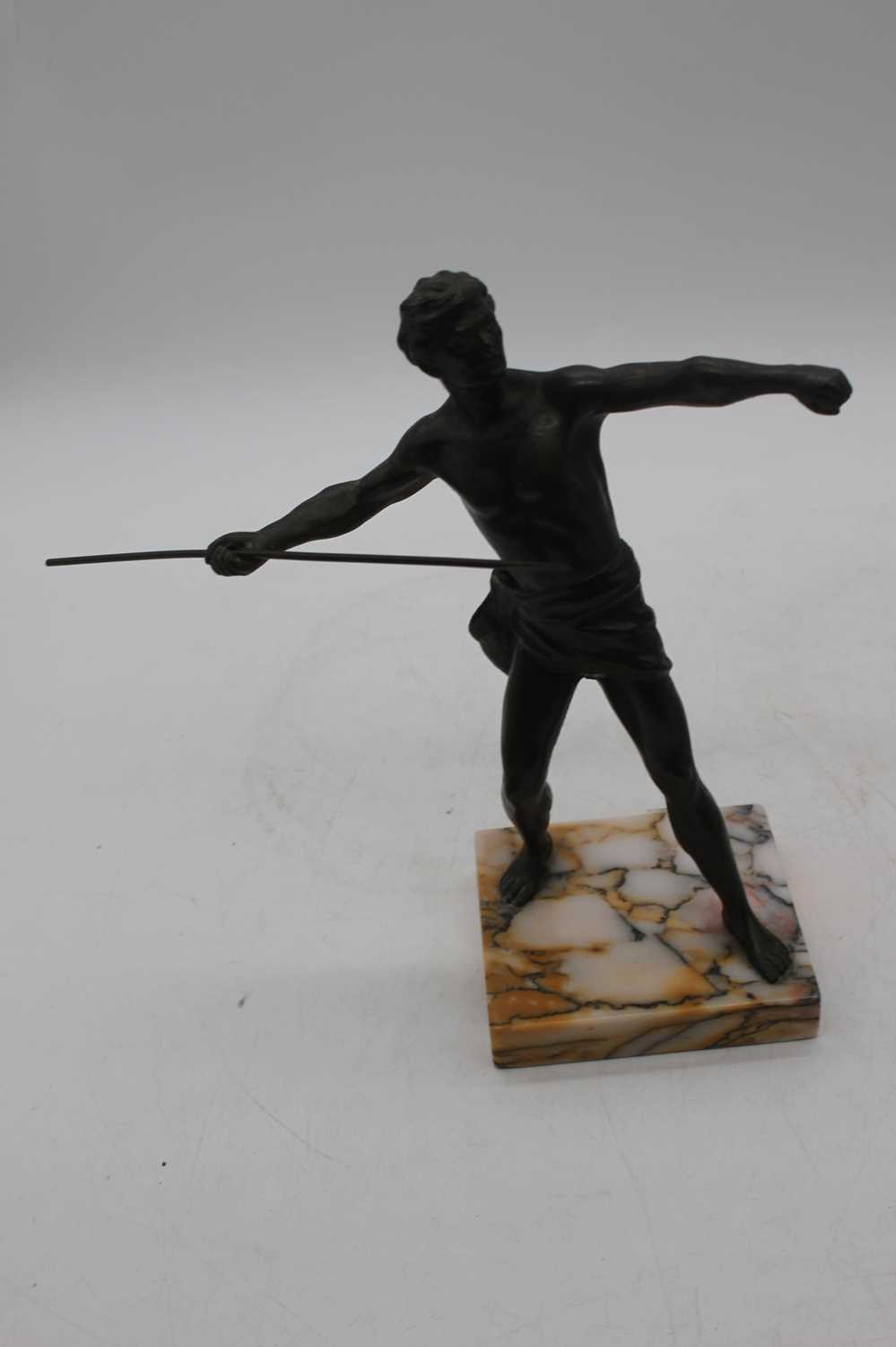 A pair of bronzed figures of athletes, each shown rasing a spear, mounted upon a polished - Image 2 of 3