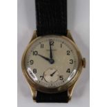A Garrard gent's 9ct gold cased manual wind wristwatch, having signed silvered dial with