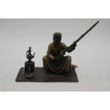 An Austrian style cold-painted metal figure of a seated gentleman, h.12cm
