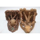 A continental stoneware wall bracket, in the form of a deer's head, height 30cm, together with