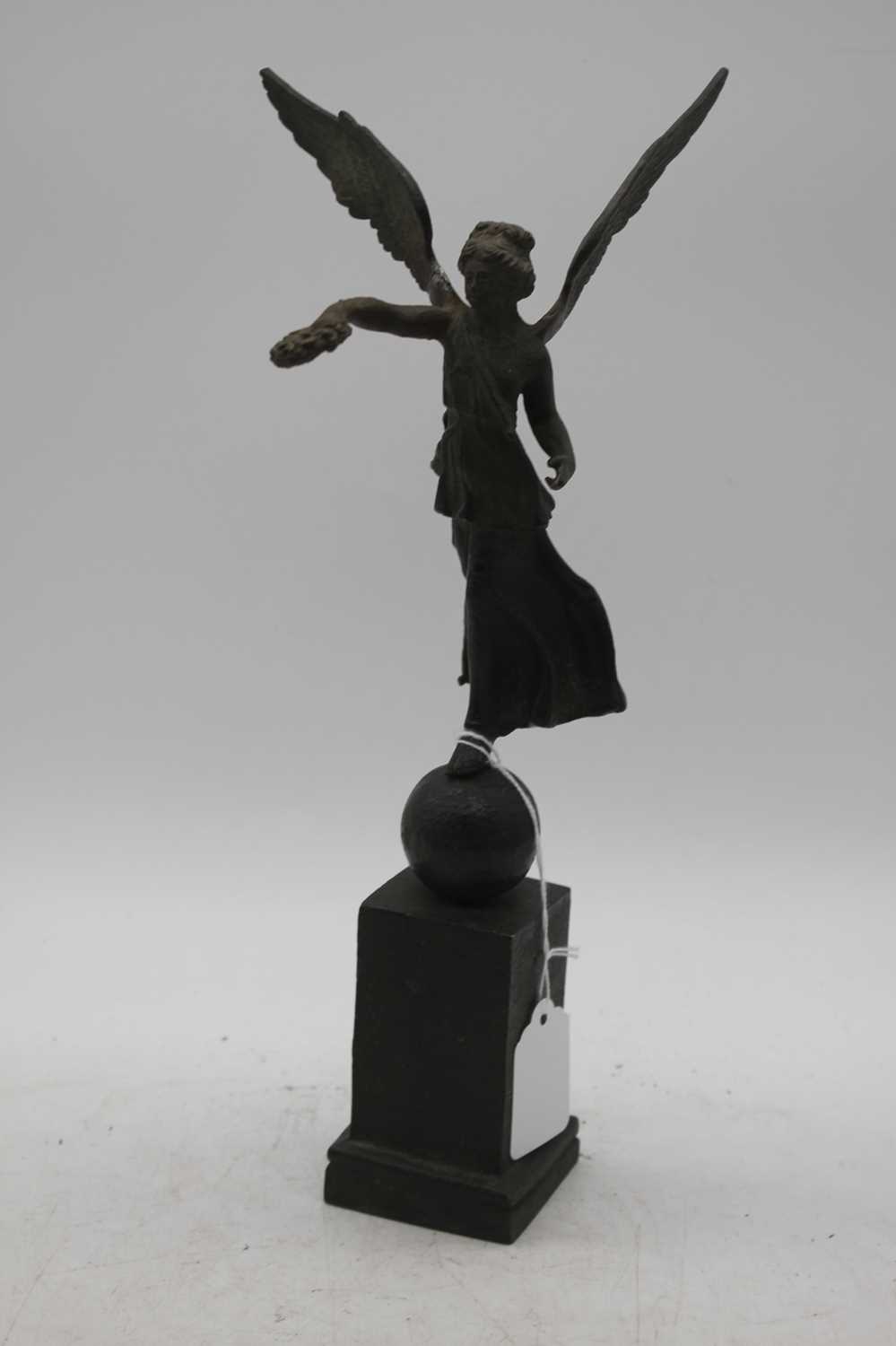 A 19th century bronze figure of Nike, showing standing upon a ball and square plinth, height 34cm - Image 3 of 3