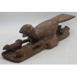 An African carved wood model of a bird, length 47cm