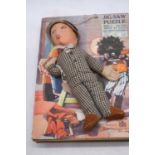 A Chad Valley Newberry Fruits wooden jigsaw puzzle; together with a "Lambeth Walk" cloth doll