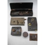 A collection of vintage lock plates and keys