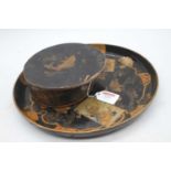 A Japanese black lacquered tray, dia. 31cm, together with two similar coasters