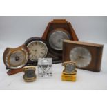 A collection of vintage clocks and barometers