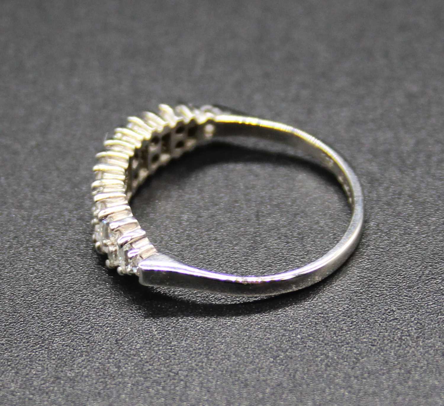 A modern 18ct white gold diamond half hoop ring, arranged as alternating baguettes and twin round - Image 2 of 2