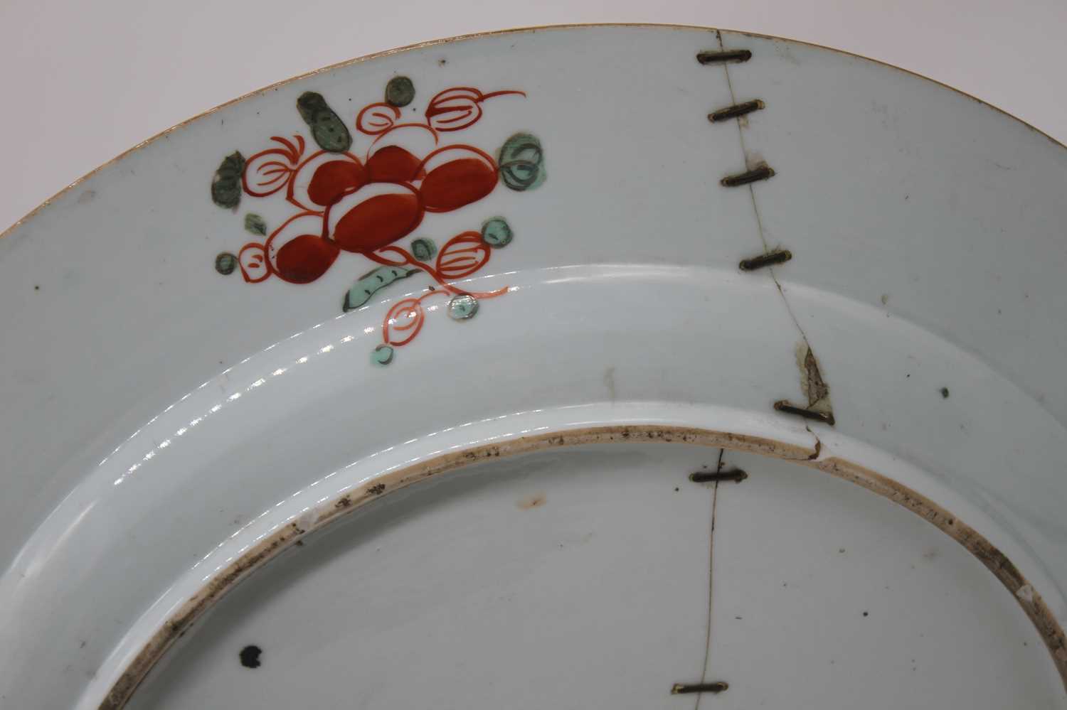 An 18th century Chinese porcelain charger, having later European 'clobbered' decoration, dia. 41cm - Image 2 of 2