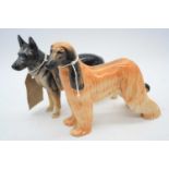An Ulrica of Brittas model of a German Shepherd, h.14cm; together with a Beswick Afghan hound '
