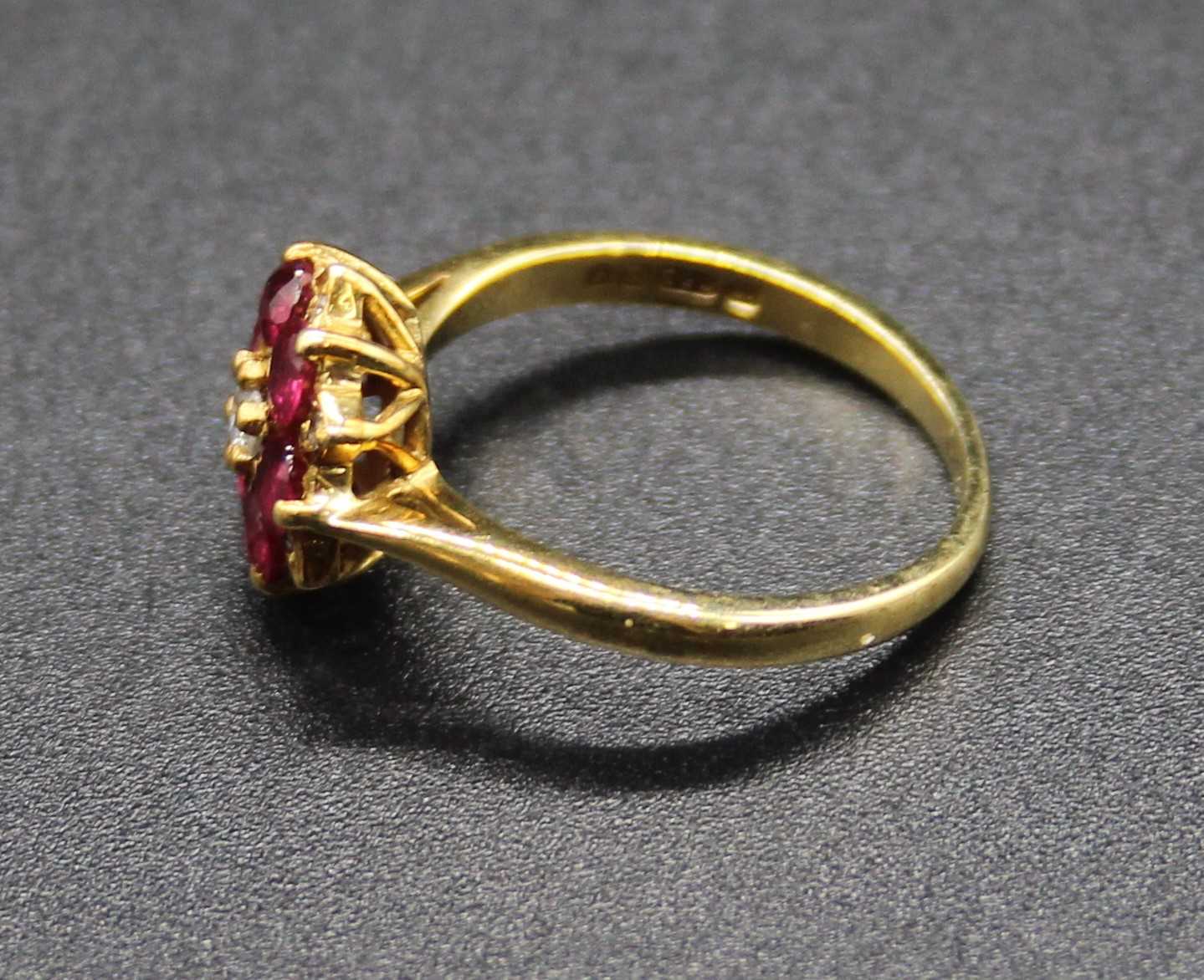 An 18ct gold, ruby and diamond cluster ring (rubies possibly heat-treated), setting dia.10mm, 2. - Image 2 of 2