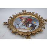 A reproduction porcelain dish, decorated with Napoleon, housed within a gilt metal mount, height