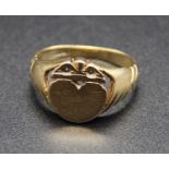 A 9ct gold signet ring, the tablet being heart shaped and surmounted with a crown, sponsor TAD, 4.