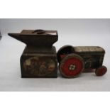 A William Crawford tractor biscuit tin, h.11cm; together with another in the form of an anvil (2)