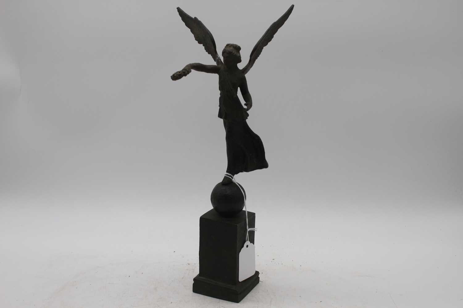 A 19th century bronze figure of Nike, showing standing upon a ball and square plinth, height 34cm - Image 2 of 3