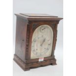 An early 20th century oak cased 8-day mantel clock, the slow/fast dial above a silvered chapter ring