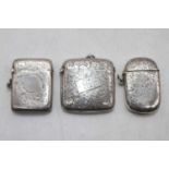 An Edwardian silver vesta of hinged rectangular form having all over foliate engraved decoration and