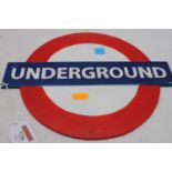 A reproduction cast iron London Underground sign, width 30cm