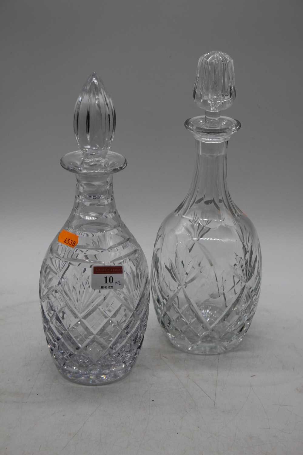 Two cut glass decanters, each of mallet form, height 30cm