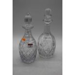 Two cut glass decanters, each of mallet form, height 30cm