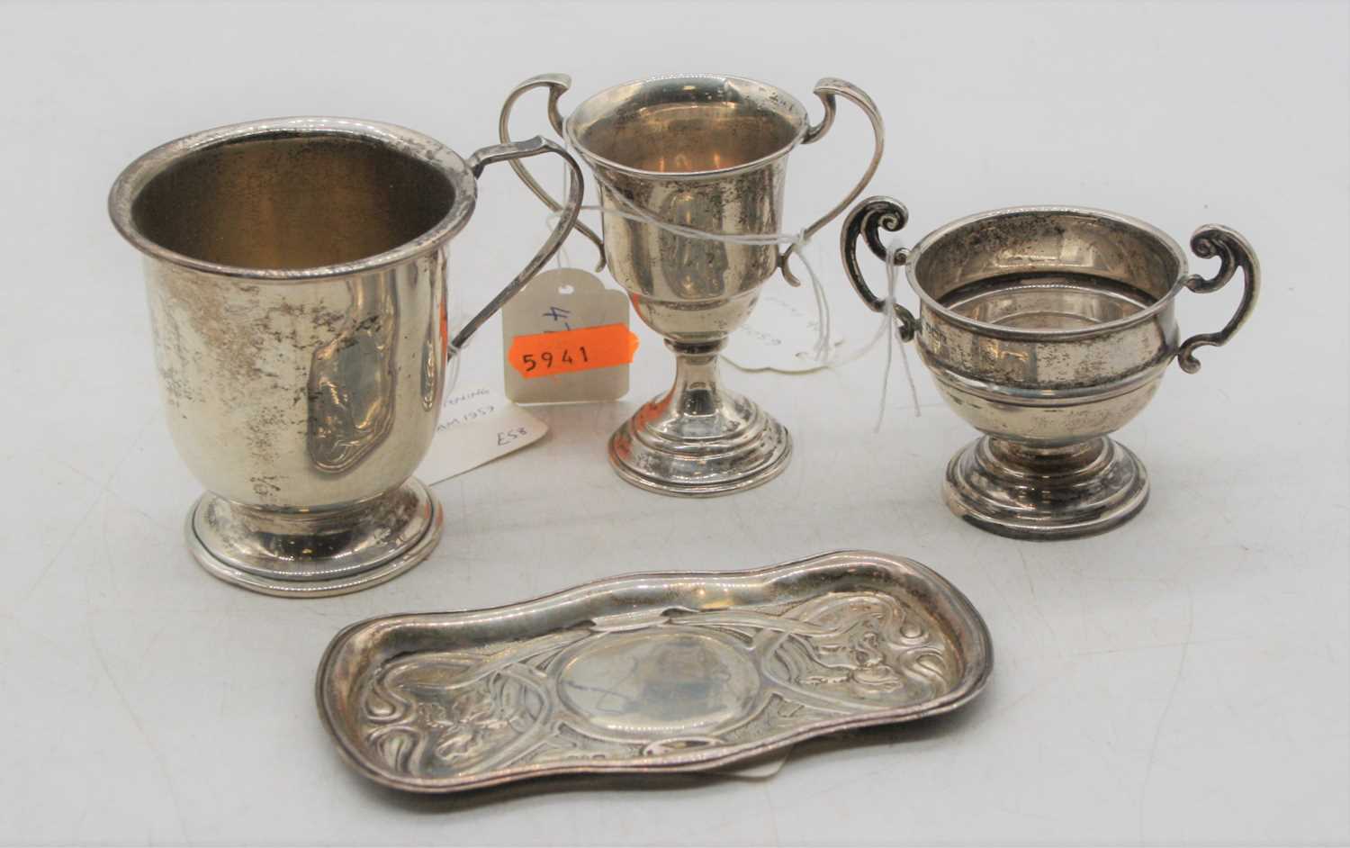 An Art Nouveau silver pin tray of shaped rectangular form having sinuous floral decoration, maker