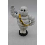 A reproduction cast iron model of the Michelin Man, h.23cm