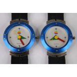 A pair of Apple quartz wristwatches, case dia.35mm, each on original rubber bracelets
