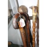 A collection of five 19th century and later walking sticks, to include a silver handled example,