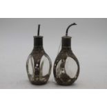 A pair of early 20th century Angostura Bitters bottles, each bottle of dimpled triform with white