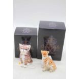 A Royal Crown Derby model of a cheetah cub, h.7.5cm; together with another of a cat, h.8.5cm,