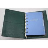 A Smythson of Bond Street green leather clad notebook