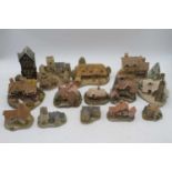 A collection of David Winter miniature resin cottages