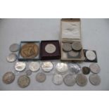 A small collection of coins to include George V 1935 rocking horse crown, Churchill crowns, Festival