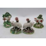 A 19th century pearlware bocage sheep group, h.13.5cm; together with three Staffordshire models of