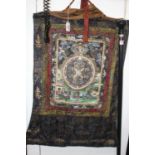 A Tibetan Thangka silk wall hanging, decorated with deities, 74 x 50cm